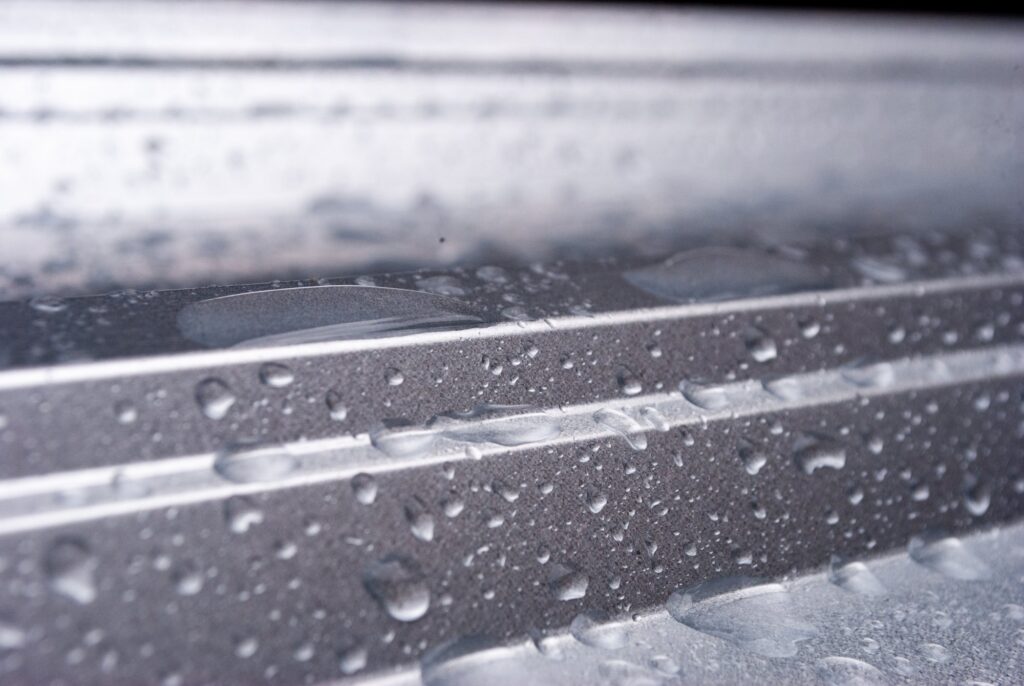 This photo shows active condensation on metal surfaces, a primary cause of the floor rust and corrosion commonly found around CRAC units in data centers.