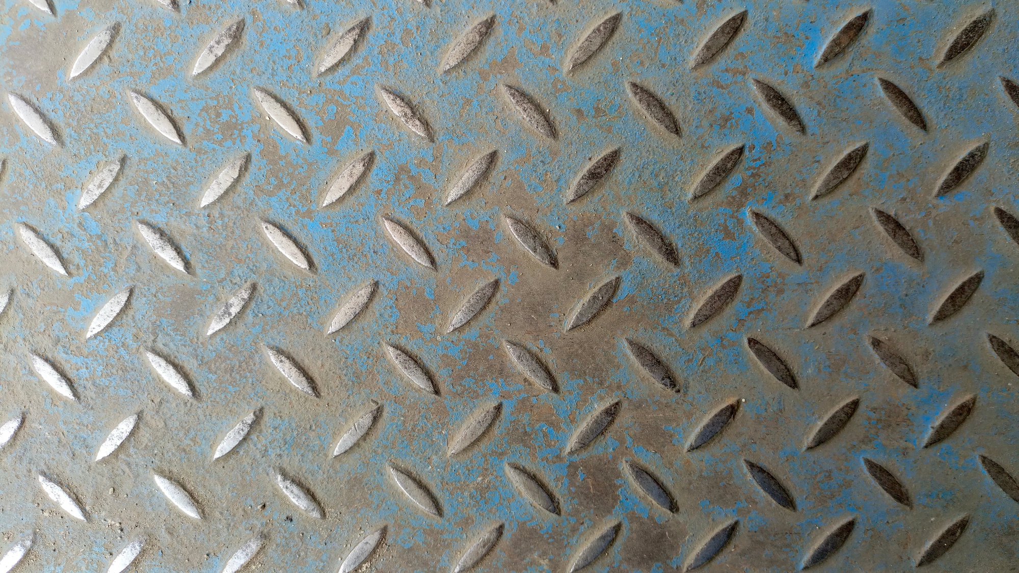 This photo shows a rusted and degraded metal floor that creates a contamination risk for sensitive next-generation AI systems